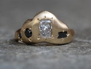 yellow gold radiant cut diamond engagement ring with black diamonds