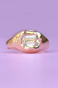 yellow gold engagement ring with emerald cut lab grown diamond
