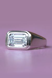 platinum engagement ring with emerald cut lab grown diamond